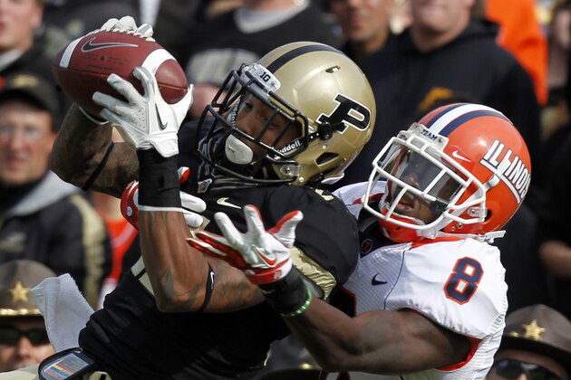 Purdue cornerback Ricardo Allen, left, intercepts a pass intended for Illinois wide receiver A.J. Jenkins during the first half of an NCAA college football game in West Lafayette, Ind., Saturday, Oct. 22, 2011. (AP Photo/Michael Conroy)