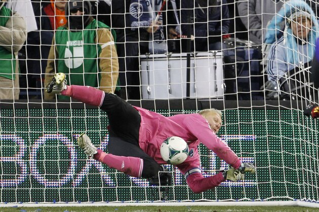 Sporting Kansas City goalkeeper Jimmy Nielsen blocks a shot during a shoot out in overtime against Real Salt Lake during the MLS Cup final soccer match in Kansas City, Kan., Saturday, Dec. 7, 2013. (AP Photo/Colin E. Braley)