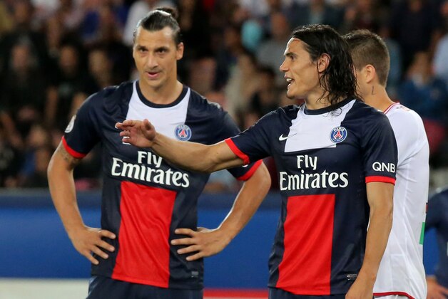 Paris Saint Germain's Uruguayan Edinson Cavani, right, reacts after missing a chance to score, while his teammeate Swedish Zlatan Ibrahimovic stands next to him during a French League One soccer match Paris Saint-Germain against AC Ajaccio Sunday, Aug. 18, 2013, in Paris. The match ended with a 1-1 draw. (AP Photo/Michel Euler)