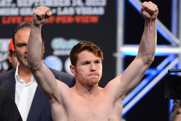 LAS VEGAS, NV - SEPTEMBER 13:  Boxer Canelo Alvarez poses during the official weigh-in for his bout against Floyd Mayweather Jr. at the MGM Grand Garden Arena on September 13, 2013 in Las Vegas, Nevada. The fighters will meet in a WBC/WBA 154-pound title fight on September 14 in Las Vegas.  (Photo by Ethan Miller/Getty Images)