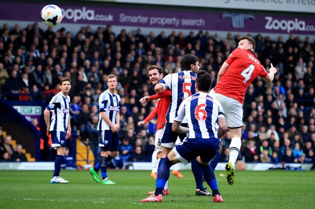 WEST BROMWICH, ENGLAND - MARCH 08:  Phil Jones of Manchester United (4) scores their first goal with a header during the Barclays Premier League match between West Bromwich Albion and Manchester United at The Hawthorns on March 8, 2014 in West Bromwich, England.  (Photo by Richard Heathcote/Getty Images)