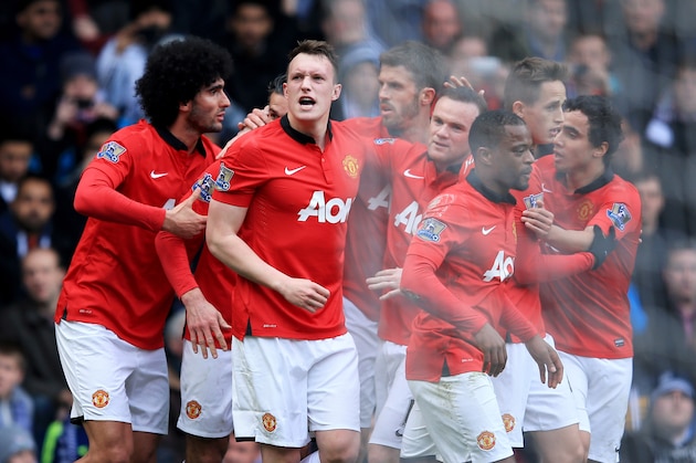 WEST BROMWICH, ENGLAND - MARCH 08:  Phil Jones of Manchester United (3L) celebrates with team mates as he scores their first goal with a header during the Barclays Premier League match between West Bromwich Albion and Manchester United at The Hawthorns on March 8, 2014 in West Bromwich, England.  (Photo by Richard Heathcote/Getty Images)
