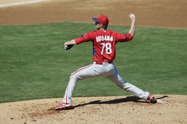 Philadelphia Phillies pitcher David Buchananan throws a pitch during an exhibition baseball game against the New York Yankees Saturday, March 1, 2014, in Tampa, Fla. (AP Photo/Charlie Neibergall)