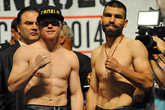 Mar 7, 2014; Las Vegas, NV, USA; Saul Canelo Alvarez (left) and Alfredo Angulo pose for photographers during a weigh-in before their super welterweight bout at MGM Grand Garden Arena. Mandatory Credit: Stephen R. Sylvanie-USA TODAY Sports Mar 7, 2014; Las Vegas, NV, USA; Saul Canelo Alvarez (left) and Alfredo Angulo pose for photographers during a weigh-in before their super welterweight bout at MGM Grand Garden Arena. Mandatory Credit: Stephen R. Sylvanie-USA TODAY Sports