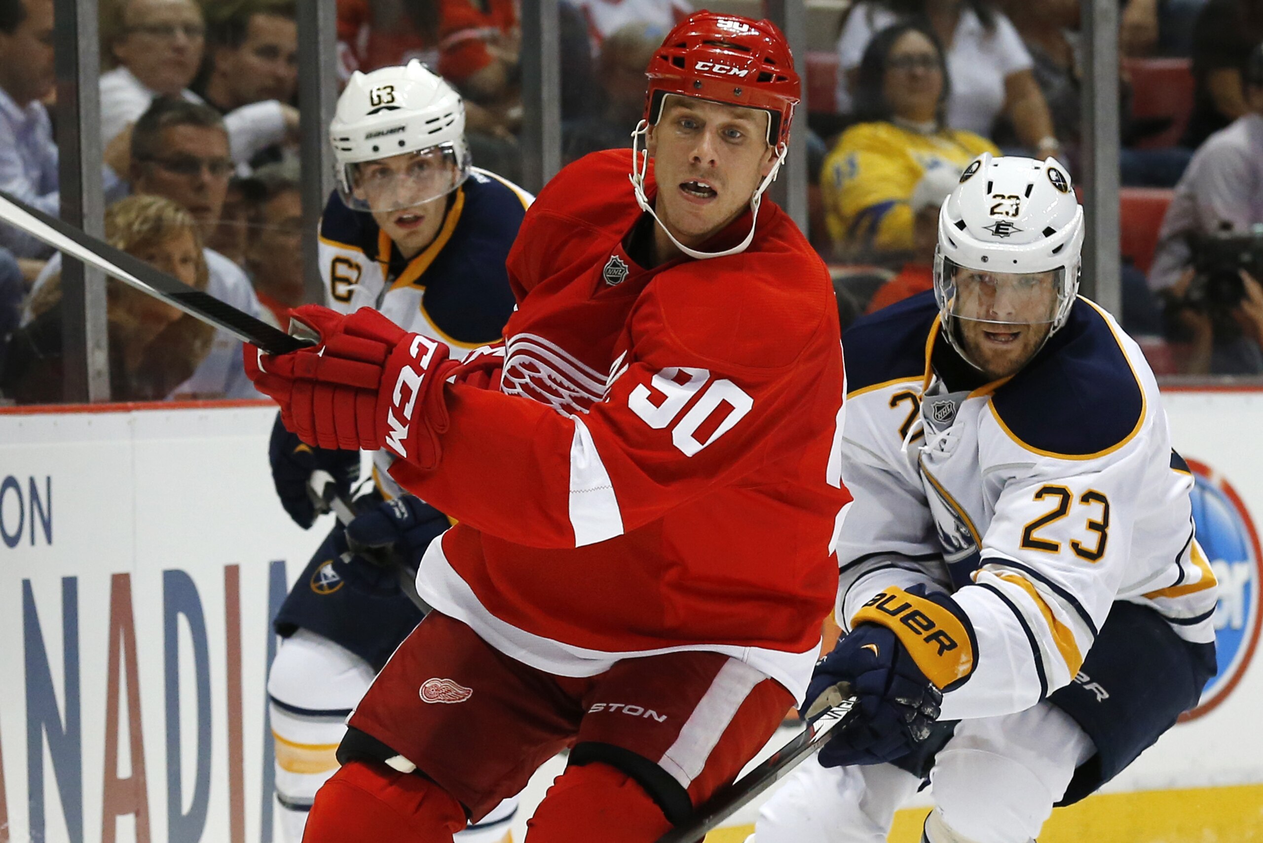 Detroit Red Wings center Stephen Weiss (90) follows the puck against the Buffalo Sabres in the first period of an NHL hockey game in Detroit, Wednesday, Oct. 2, 2013. (AP Photo/Paul Sancya)