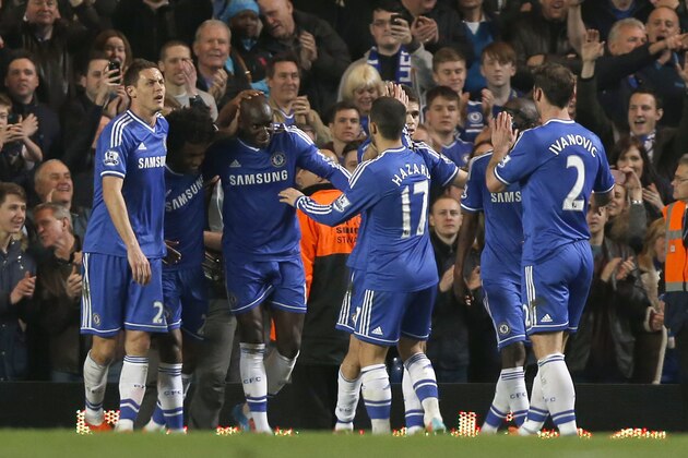 Chelsea's Demba Ba, third left, celebrates his goal against Tottenham Hotspur with teammates during their English Premier League soccer match at Stamford Bridge, London, Saturday, March 8, 2014. (AP Photo/Sang Tan)