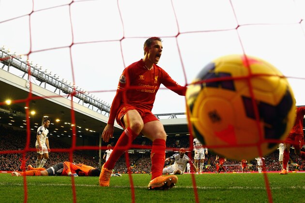 LIVERPOOL, ENGLAND - FEBRUARY 23:  Jordan Henderson of Liverpool celebrates scoring the winning goal during the Barclays Premier League match between Liverpool and Swansea City at Anfield on February 23, 2014 in Liverpool, England.  (Photo by Clive Brunskill/Getty Images)