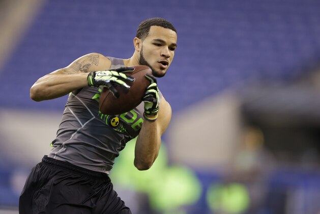 Rice defensive back Phillip Gaines runs a drill at the NFL football scouting combine in Indianapolis, Tuesday, Feb. 25, 2014. (AP Photo/Michael Conroy)