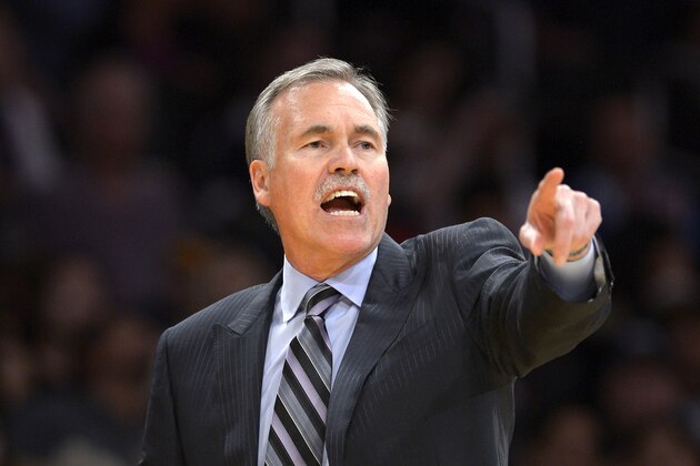 Los Angeles Lakers head coach Mike D'Antoni gestures during the second half of an NBA basketball game against the Sacramento Kings, Friday, Feb. 28, 2014, in Los Angeles. (AP Photo/Mark J. Terrill)