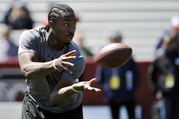 Running back Marcus Lattimore makes a catch during South Carolina's NFL football pro day on Wednesday, March 27, 2013 in Columbia, S.C. (AP Photo/Rainier Ehrhardt)