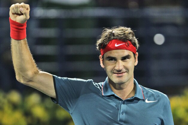 Roger Federer of Switzerland celebrates after he beat Novak Djokovic of Serbia during a semifinal match of the Dubai Tennis Championships in Dubai, United Arab Emirates, Friday, Feb. 28, 2014. (AP Photo/Kamran Jebreili)