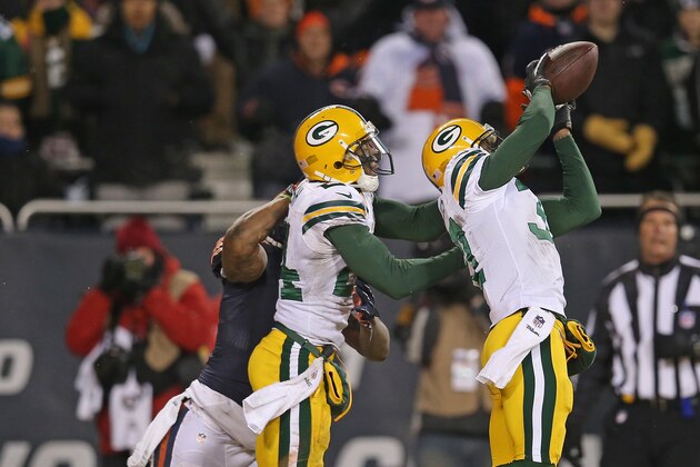 CHICAGO, IL - DECEMBER 29: Sam Shields #37 of the Green Bay Packers intercepts the final throw of the game in front of teammate Jarrett Bush #24 and Brandon Marshall #15 of the Chicago Bears at Soldier Field on December 29, 2013 in Chicago, Illinois. The Packers defeated the Bears 33-28.  (Photo by Jonathan Daniel/Getty Images)