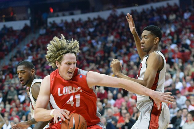 LAS VEGAS, NV - FEBRUARY 19:  Cameron Bairstow #41 of the New Mexico Lobos drives against Roscoe Smith #1 (L) and Christian Wood #5 of the UNLV Rebels during their game at the Thomas & Mack Center on February 19, 2014 in Las Vegas, Nevada. New Mexico won 68-56.  (Photo by Ethan Miller/Getty Images)