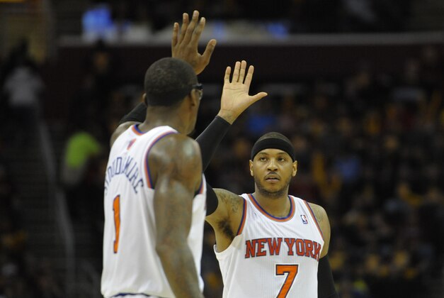 Mar 8, 2014; Cleveland, OH, USA; New York Knicks small forward Carmelo Anthony (7) celebrates with power forward Amar'e Stoudemire (1) in the fourth quarter against the Cleveland Cavaliers at Quicken Loans Arena. Mandatory Credit: David Richard-USA TODAY Sports