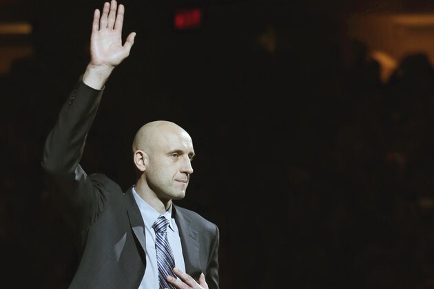 Zydrunas Ilgauskas is introduced during halftime of an NBA basketball game between the New York Knicks and the Cleveland Cavaliers on Saturday, March 8, 2014, in Cleveland. Soft-spoken and doggedly determined, Ilgauskas, who overcame serious injuries and personal tragedy to become one of Cleveland's best and most beloved players, had his No. 11 jersey retired Saturday night during an elaborate halftime ceremony certain to be emotionally poignant. (AP Photo/Tony Dejak)