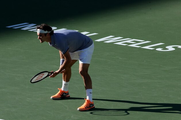 INDIAN WELLS, CA - MARCH 08:  Roger Federer of Switzerland waits to receive a serve from Paul-Henri Mathieu of France during the BNP Paribas Open at Indian Wells Tennis Garden on March 8, 2014 in Indian Wells, California.  Federer won 6-2, 7-6(5).  (Photo by Stephen Dunn/Getty Images)