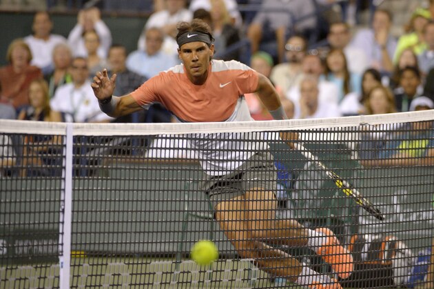 Rafael Nadal, of Spain, returns a shot to Radek Stepanek, of the Czech Republic, during their match at the BNP Paribas Open tennis tournament, Saturday, March 8, 2014, in Indian Wells, Calif. (AP Photo/Mark J. Terrill)