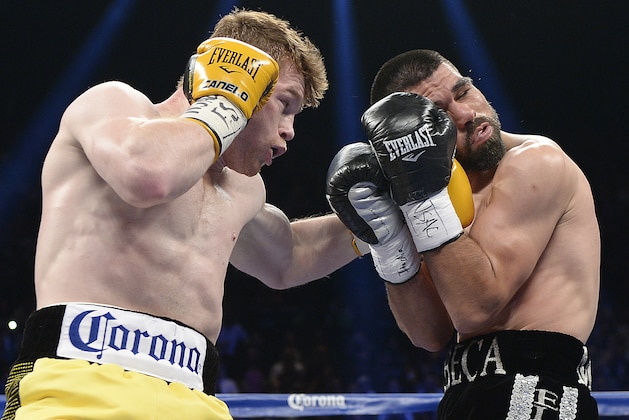 LAS VEGAS, NV - MARCH 8: Canelo Alvarez throws a punch against Alfredo Angulo during their non-title, 12-round super welterweight bout at the MGM Grand Garden March 8, 2014, in Las Vegas, Nevada. (Photo by Kevork Djansezian/Getty Images)