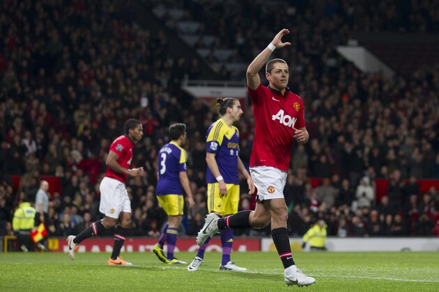 Manchester United's Javier Hernandez celebrates after scoring against Swansea City during their English FA Cup third round soccer match at Old Trafford Stadium, Manchester, England, Sunday Jan. 5, 2014. (AP Photo/Jon Super)