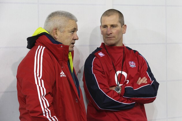 BURTON-UPON-TRENT, ENGLAND - FEBRUARY 13:  Warren Gatland (L) the British and Irish Lions head coach talks to England head coach Stuart Lancaster during the England training session held at St Georges Park on February 13, 2013 in Burton-upon-Trent, England.  (Photo by David Rogers/Getty Images)