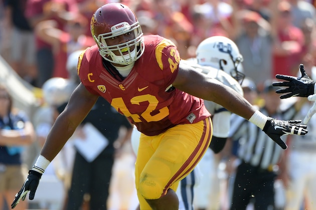 LOS ANGELES, CA - SEPTEMBER 21:  Devon Kennard #42 of the USC Trojans celebrates his sack on third down during a 17-14 win over the Utah State Aggies at the Los Angeles Memorial Coliseum on September 21, 2013 in Los Angeles, California.  (Photo by Harry How/Getty Images)