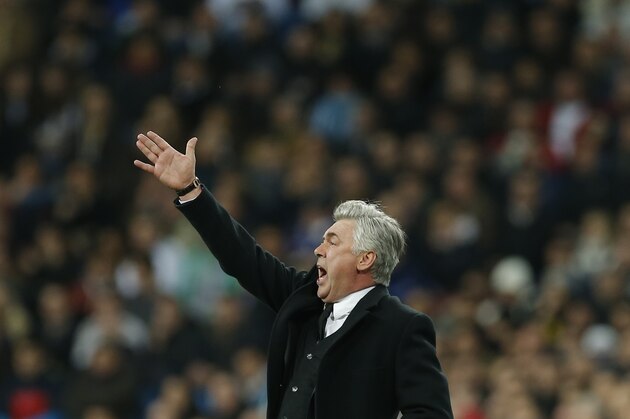 Real's coach Carlo Ancelotti shouts during a semi final, 1st leg, Copa del Rey soccer derby match between Real Madrid and Atletico Madrid at the Santiago Bernabeu Stadium in Madrid, Wednesday Feb. 5, 2014.  (AP Photo/Paul White)