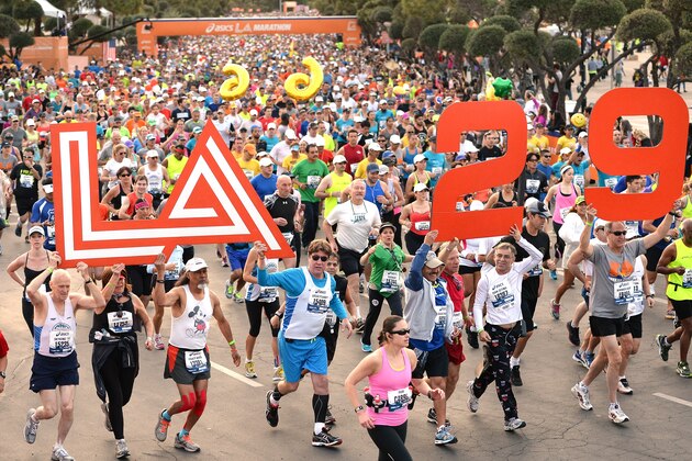 LOS ANGELES, CA - MARCH 09:  Competitors hold signs to indicate the 29th running at the start of the Los Angeles Marathon at Dodger Stadium on March 9, 2014 in Los Angeles, California.  (Photo by Harry How/Getty Images)