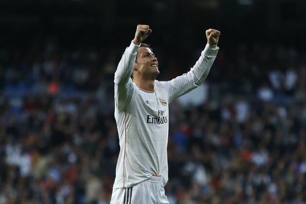 Real's Cristiano Ronaldo celebrates his goal during a Spanish La Liga soccer match between Real Madrid and Levante at the Santiago Bernabeu stadium in Madrid, Spain, Sunday March 9, 2014. (AP Photo/Andres Kudacki)