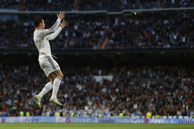 Real's Cristiano Ronaldo celebrates his goal during a Spanish La Liga soccer match between Real Madrid and Levante at the Santiago Bernabeu stadium in Madrid, Spain, Sunday, March 9, 2014. (AP Photo/Andres Kudacki)