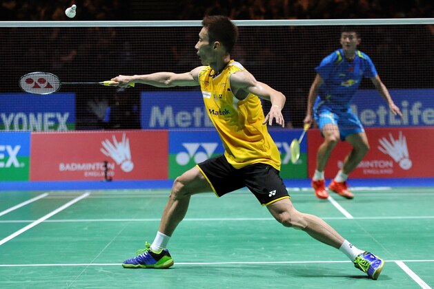 Malaysia's Lee Chong Wei in action against China's Chen Long. Lee Chong Wei won the Men's Singles Final by beating Chen Long, 21-13, 21-18, during the Final of the Men's Singles, at the Yonex All England Open 2014 at the National Indoor Arena in Birmingham, England, Sunday, March  9, 2014.  (AP Photo/Rui Vieira)