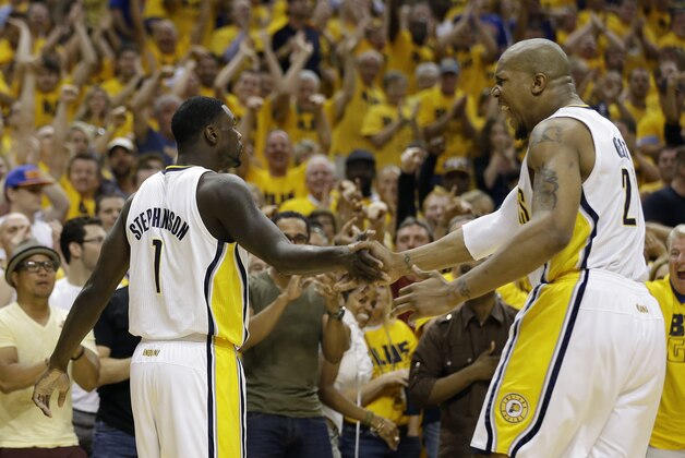 Indiana Pacers' Lance Stephenson (1) celebrates with teammate David West after hitting a basket and being fouled during the second half of Game 6 of an Eastern Conference semifinal NBA basketball playoff series against the New York Knicks, Saturday, May 18, 2013, in Indianapolis. Indiana defeated New York 106-99 to win the series 4-2. (AP Photo/Darron Cummings)