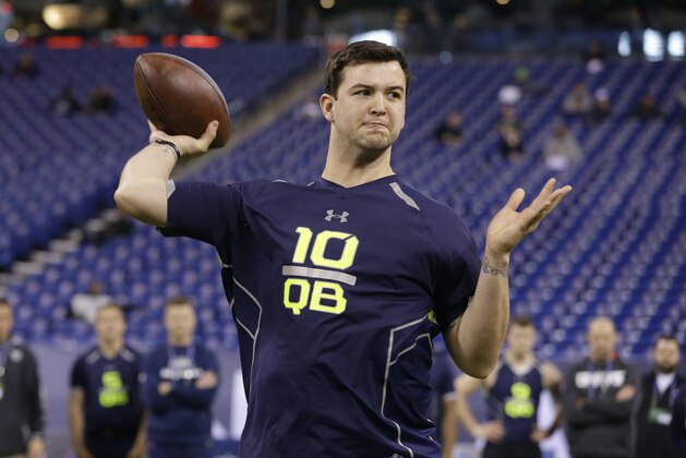 Alabama quarterback AJ McCarron throws during a drill at the NFL football scouting combine in Indianapolis, Sunday, Feb. 23, 2014. (AP Photo/Michael Conroy)