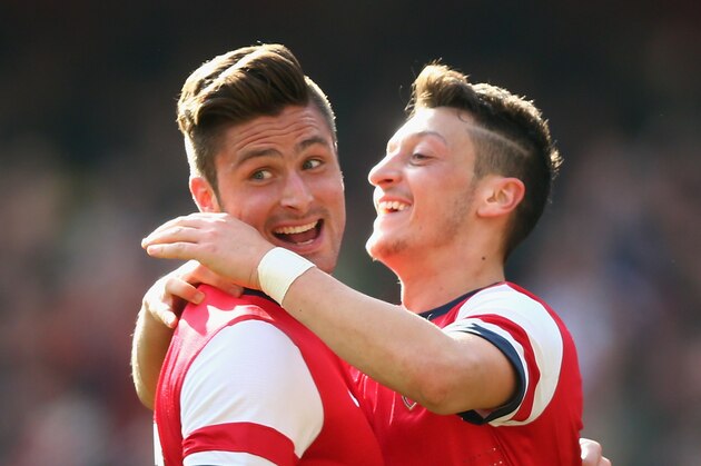 LONDON, ENGLAND - MARCH 08:  Olivier Giroud of Arsenal celebrates with teammate Mesut Oezil after scoring his team's fourth goal during the FA Cup Quarter-Final match between Arsenal and Everton at Emirates Stadium on March 8, 2014 in London, England.  (Photo by Paul Gilham/Getty Images)