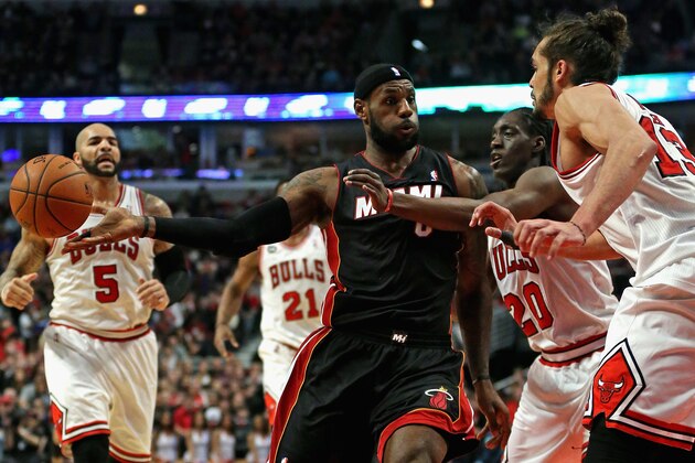 CHICAGO, IL - MARCH 09: LeBron James #6 of the Miami Heat passes under pressure from Tony Snell #20 and Joakim Noah #13 of the Chicago Bulls at the United Center on March 9, 2014 in Chicago, Illinois. NOTE TO USER: User expressly acknowledges and agrees that, by downloading and or using this photograph, User is consenting to the terms and conditions of the Getty Images License Agreement. (Photo by Jonathan Daniel/Getty Images) CHICAGO, IL - MARCH 09: LeBron James #6 of the Miami Heat passes under pressure from Tony Snell #20 and Joakim Noah #13 of the Chicago Bulls at the United Center on March 9, 2014 in Chicago, Illinois. NOTE TO USER: User expressly acknowledges and agrees that, by downloading and or using this photograph, User is consenting to the terms and conditions of the Getty Images License Agreement. (Photo by Jonathan Daniel/Getty Images)