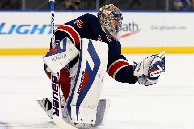 NEW YORK, NY - MARCH 09:  Henrik Lundqvist #30 of the New York Rangers stops a shot in the first period against the Detroit Red Wings at Madison Square Garden on March 9, 2014 in New York City.  (Photo by Elsa/Getty Images)