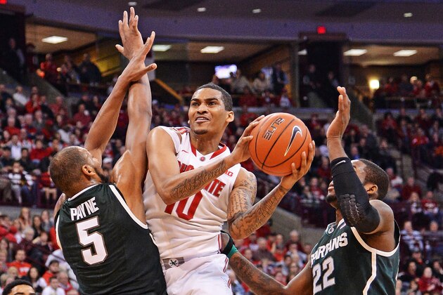COLUMBUS, OH - MARCH 9: LaQuinton Ross #10 of the Ohio State Buckeyes splits the defense of Adreian Payne #5 of the Michigan State Spartans and Branden Dawson #22 of the Michigan State Spartans in the second half on March 9, 2014 at Value City Arena in Columbus, Ohio. Ohio State defeated Michigan State 69-67. (Photo by Jamie Sabau/Getty Images) COLUMBUS, OH - MARCH 9: LaQuinton Ross #10 of the Ohio State Buckeyes splits the defense of Adreian Payne #5 of the Michigan State Spartans and Branden Dawson #22 of the Michigan State Spartans in the second half on March 9, 2014 at Value City Arena in Columbus, Ohio. Ohio State defeated Michigan State 69-67. (Photo by Jamie Sabau/Getty Images)