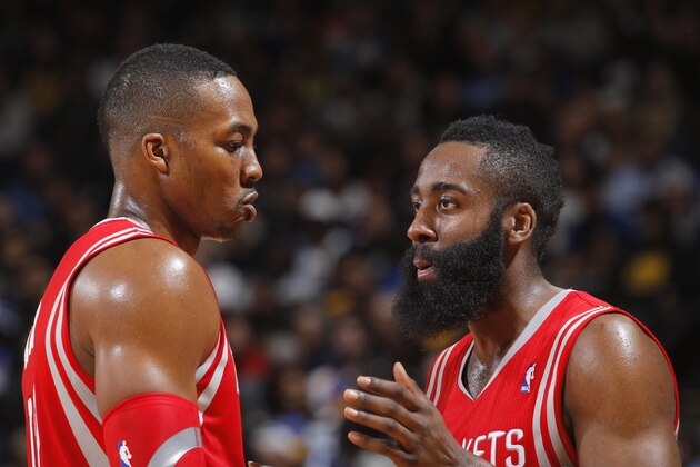 OAKLAND, CA - FEBRUARY 20: Dwight Howard #12 and James Harden #13 of the Houston Rockets during a game against the Golden State Warriors on February 20, 2014 at Oracle Arena in Oakland, California. NOTE TO USER: User expressly acknowledges and agrees that, by downloading and or using this photograph, user is consenting to the terms and conditions of Getty Images License Agreement. Mandatory Copyright Notice: Copyright 2014 NBAE (Photo by Rocky Widner/NBAE via Getty Images)