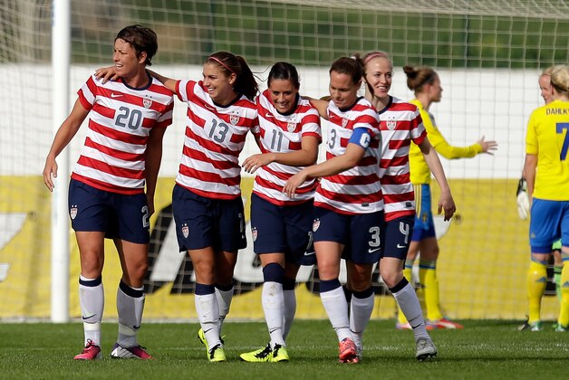 Alex Morgan, 2nd left, of the US, celebrates after scoring a goal against Sweden during their Algarve Cup  women's soccer match Monday, March 11, 2013, in Lagos, southern Portugal. (AP Photo/Armando Franca)
