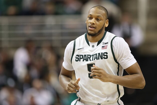 EAST LANSING, MI - FEBRUARY 13:  Adreian Payne #5 of the Michigan State Spartans looks towards the bench during the second half of the game against the Northwestern Wildcats at Breslin Center on February 13, 2014 in East Lansing, Michigan. The Spartans defeated the Wildcats 85-70.  (Photo by Leon Halip/Getty Images)