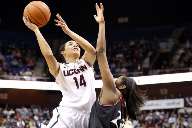 Mar 8, 2014; Uncasville, CT, USA; Connecticut Huskies guard Bria Hartley (14) shoots against Cincinnati Bearcats guard Jasmine Whitfield (23) during the first half in the quarterfinal round of the American League Athletic Conference Tournament at Mohegan Sun Arena. Mandatory Credit: David Butler II-USA TODAY Sports