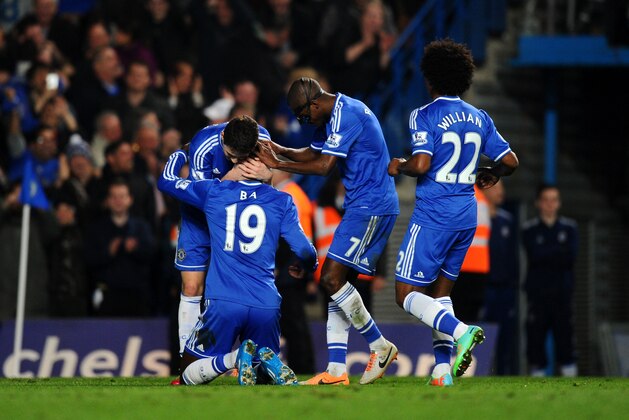LONDON, ENGLAND - MARCH 08:  (L-R) Demba Ba #19 of Chelsea celebrates with teammates Oscar, Ramires and Willian after scoring his team's fourth goal during the Barclays Premier League match between Chelsea and Tottenham Hotspur at Stamford Bridge on March 8, 2014 in London, England.  (Photo by Mike Hewitt/Getty Images)