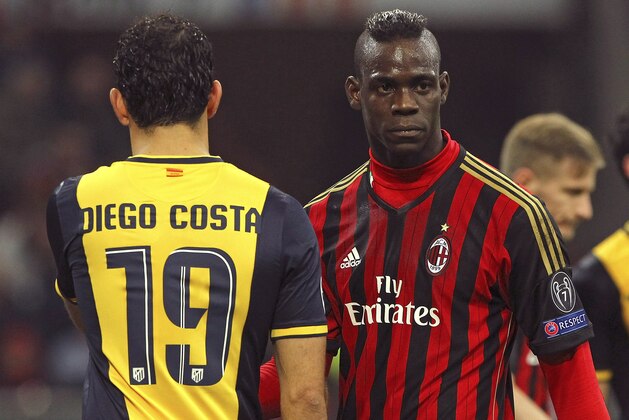 MILAN, ITALY - FEBRUARY 19:  Mario Balotelli (R) of AC Milan and Diego Costa of Club Atletico de Madrid look on during the UEFA Champions League Round of 16 match between AC Milan and Club Atletico de Madrid at Stadio Giuseppe Meazza on February 19, 2014 in Milan, Italy.  (Photo by Marco Luzzani/Getty Images)