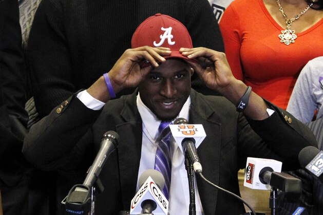 Rashaan Evans chooses Alabama as his commitment to play NCAA college football during national signing day on Wednesday, Feb. 5, 2014, in Auburn, Ala. (AP Photo/Butch Dill)