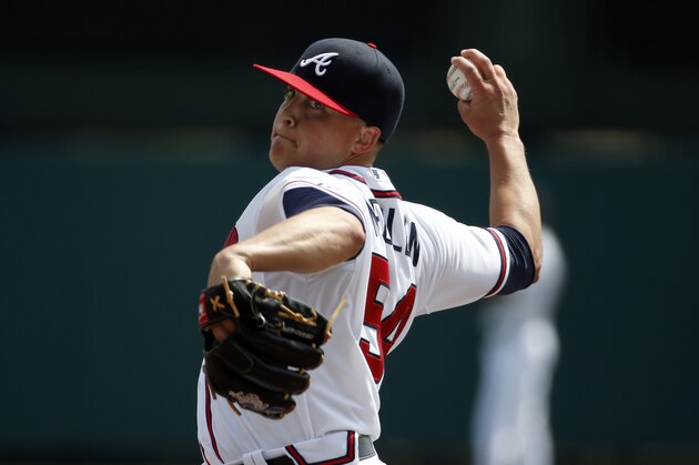 Atlanta Braves starting pitcher Kris Medlen (54) warms up from the mound before the first inning in a spring exhibition baseball game against the Washington Nationals, Tuesday, March 4, 2014, in Kissimmee, Fla. (AP Photo/Alex Brandon)
