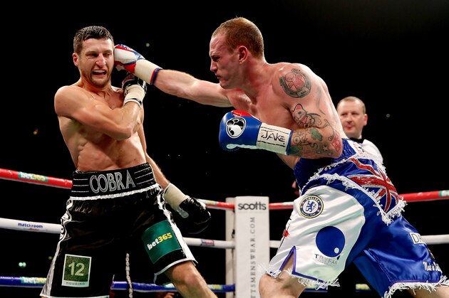 MANCHESTER, ENGLAND - NOVEMBER 23:  Carl Froch (L) in action with George Groves during their IBF and WBA World Super Middleweight bout at Phones4u Arena on November 23, 2013 in Manchester, England.  (Photo by Scott Heavey/Getty Images)