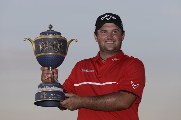 Patrick Reed holds The Gene Sarazen Cup after winning the Cadillac Championship golf tournament Sunday, March 9, 2014, in Doral, Fla. Reed won with a score 4-under-par 284 (AP Photo/Wilfredo Lee)