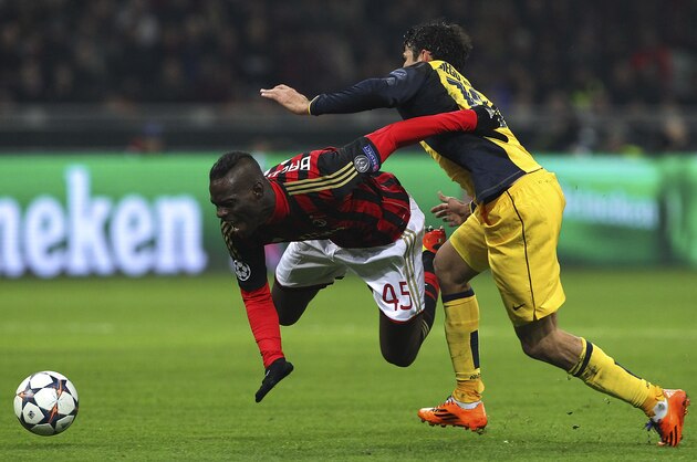 MILAN, ITALY - FEBRUARY 19:  Mario Balotelli of AC Milan clashes with Diego Costa of Club Atletico de Madrid during the UEFA Champions League Round of 16 match between AC Milan and Club Atletico de Madrid at Stadio Giuseppe Meazza on February 19, 2014 in Milan, Italy.  (Photo by Marco Luzzani/Getty Images)