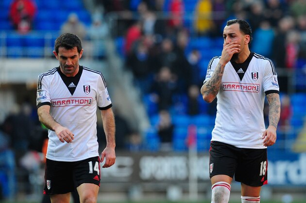 CARDIFF, WALES - MARCH 08:  Giorgos Karagounis (l) and Konstantinos Mitroglou of Fulham react after the Barclays Premier league match between Cardiff City and Fulham at Cardiff City Stadium on March 8, 2014 in Cardiff, Wales.  (Photo by Stu Forster/Getty Images)