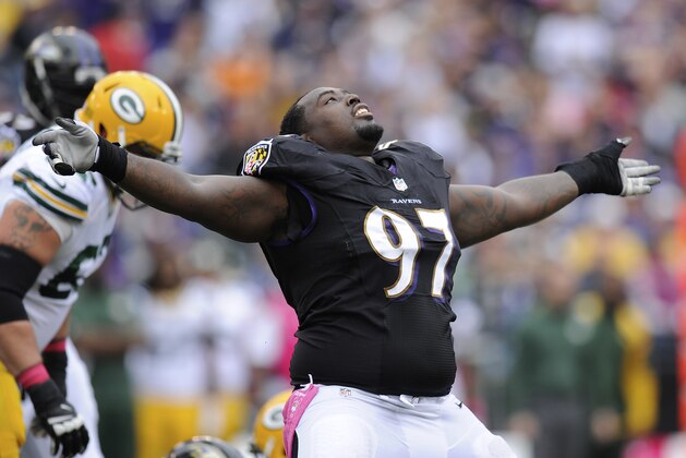 Baltimore Ravens defensive end Arthur Jones reacts to his sack of Green Bay Packers quarterback Aaron Rodgers during the first half of a NFL football game in Baltimore, Sunday, Oct. 13, 2013. (AP Photo/Nick Wass)