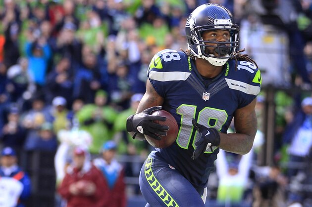 In this Sept. 22, 2013, photo, Seattle Seahawks' Sidney Rice (18) scores against the Jacksonville Jaguars during an NFL football game in Seattle. The Seahawks confirmed Tuesday, Oct. 29, that Rice will miss the rest of the season after suffering an ACL tear in his knee on Monday. (AP Photo/Stephen Brashear)